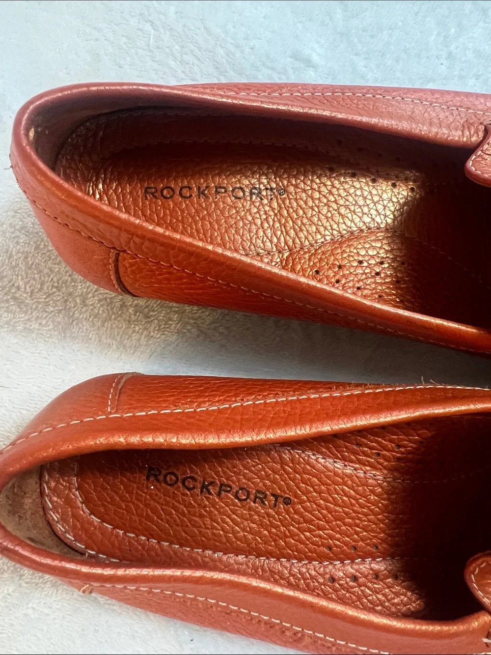 Rockport women’s orange pebbled leather square toe penny loafers